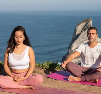 A serene yoga session overlooking the ocean in Portugal, perfect for relaxation and meditation.